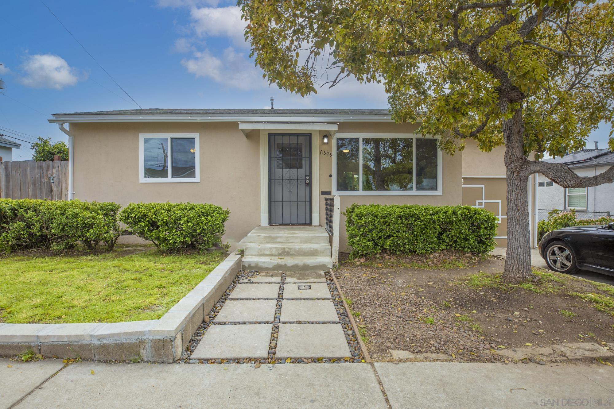 front view of a house with a yard
