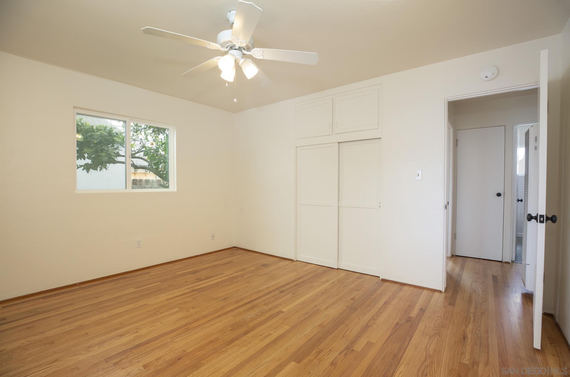 6979 Tower Street La Mesa, CA 91942 - Photo 15 of 30 wooden floor in an empty room with a window