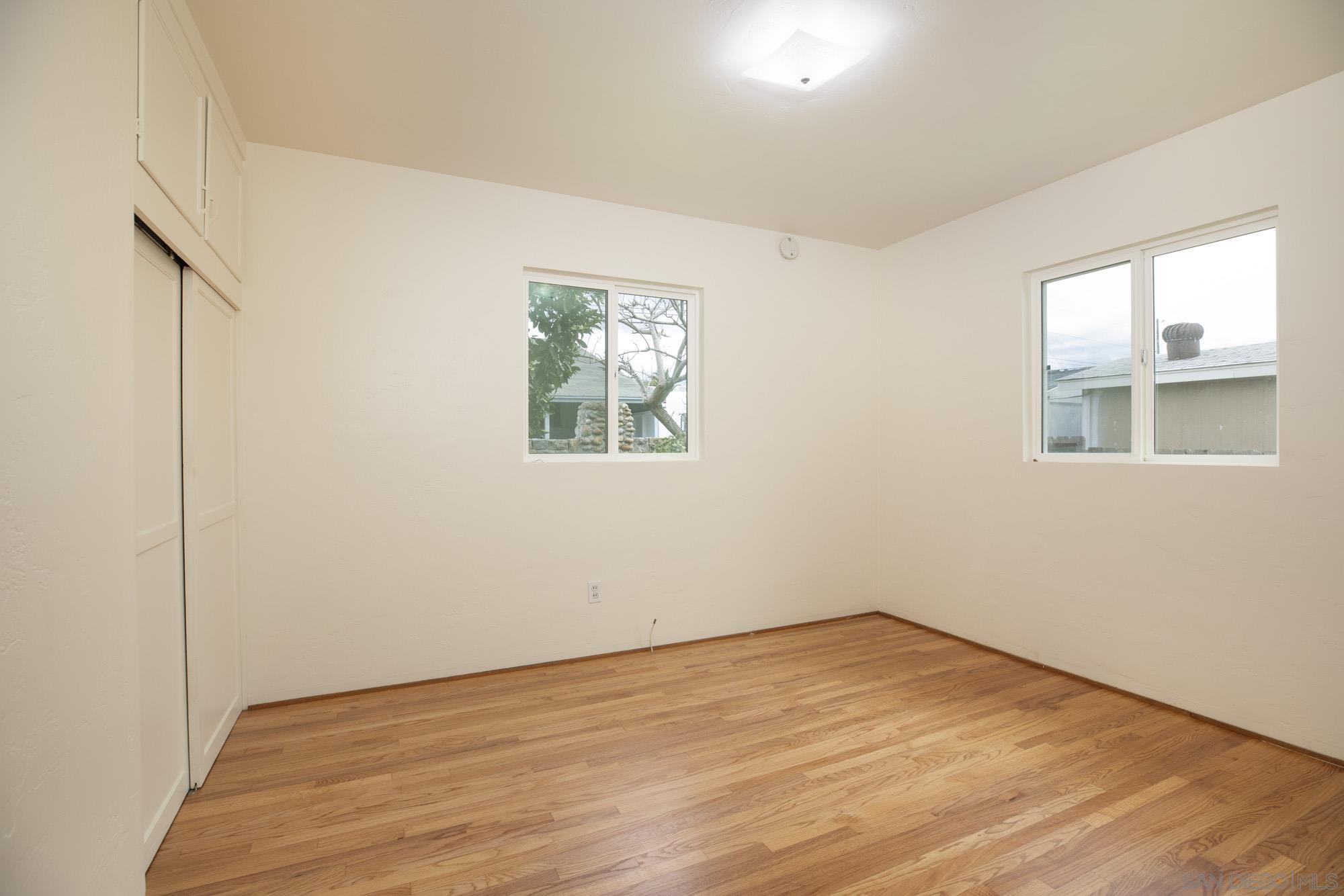 6979 Tower Street La Mesa, CA 91942 - Photo 20 of 30 a view of empty room with wooden floor and fan