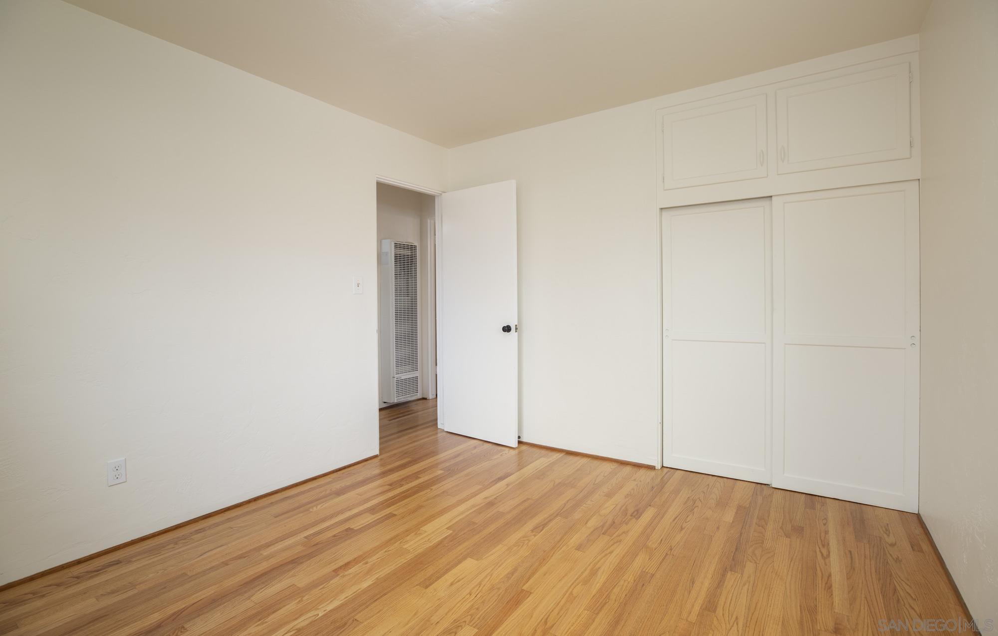 6979 Tower Street La Mesa, CA 91942 - Photo 22 of 30 a view of an empty room with wooden floor