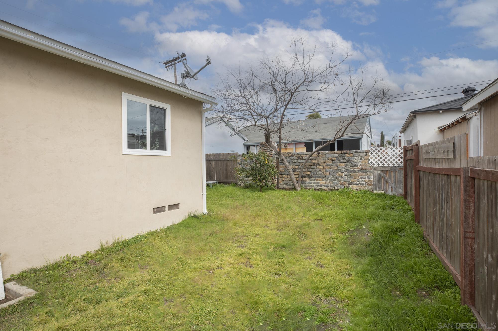 6979 Tower Street La Mesa, CA 91942 - Photo 30 of 30 a front view of house with yard and green space
