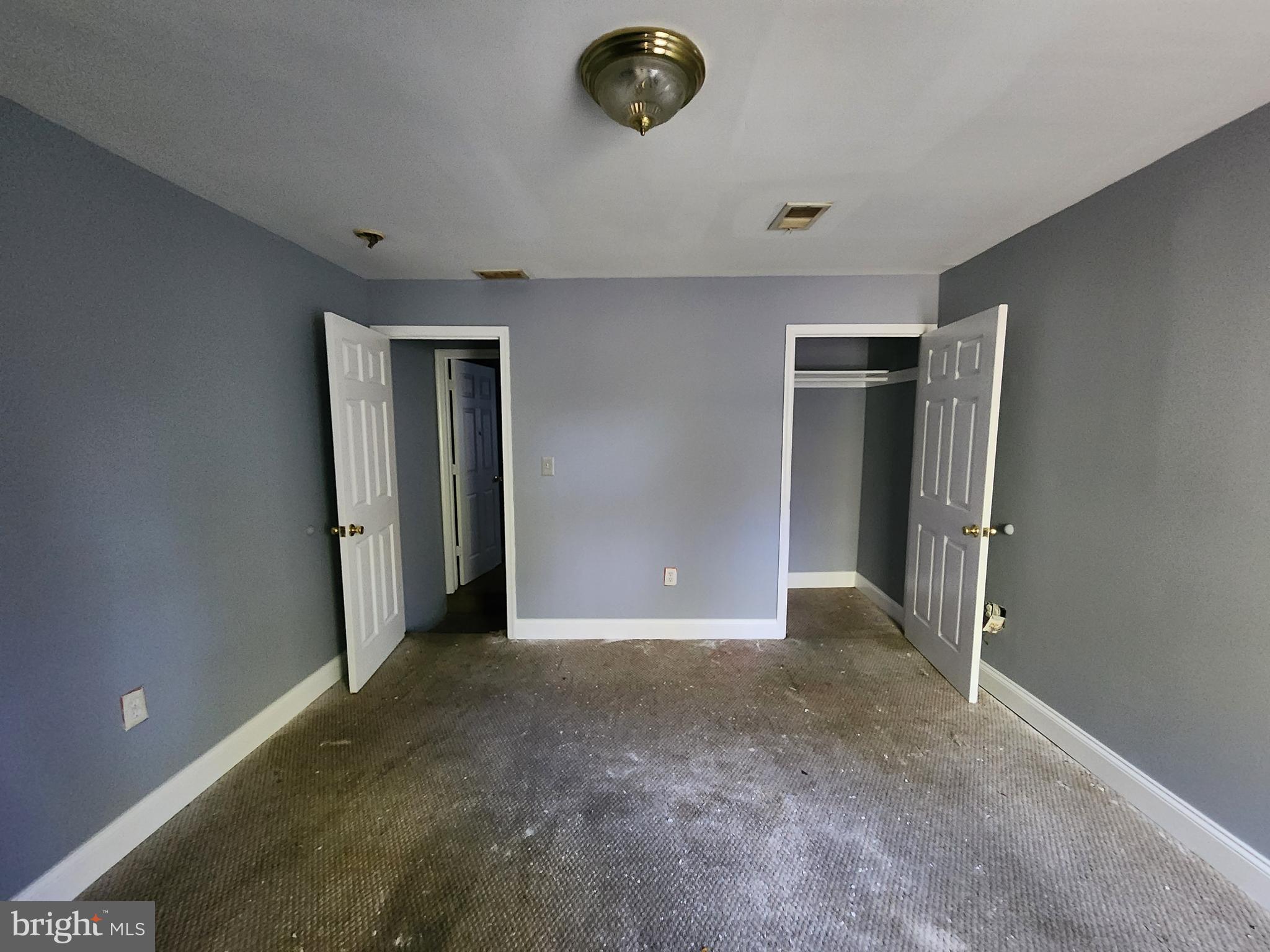 32 South Fulton Avenue Baltimore, MD 21223 - Photo 11 of 29 an empty room with window and ceiling fan
