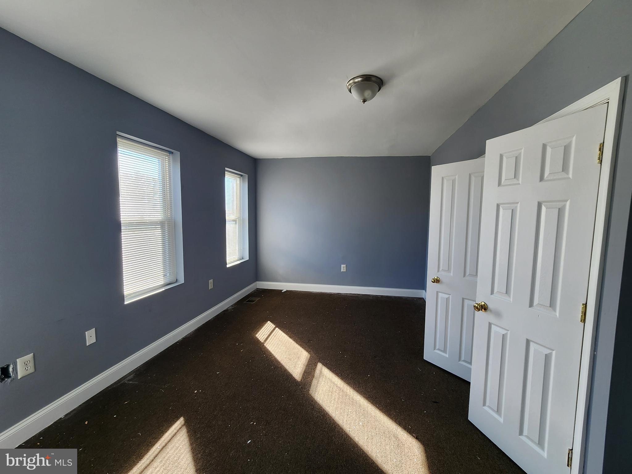 32 South Fulton Avenue Baltimore, MD 21223 - Photo 25 of 29 wooden floor in an empty room with a window