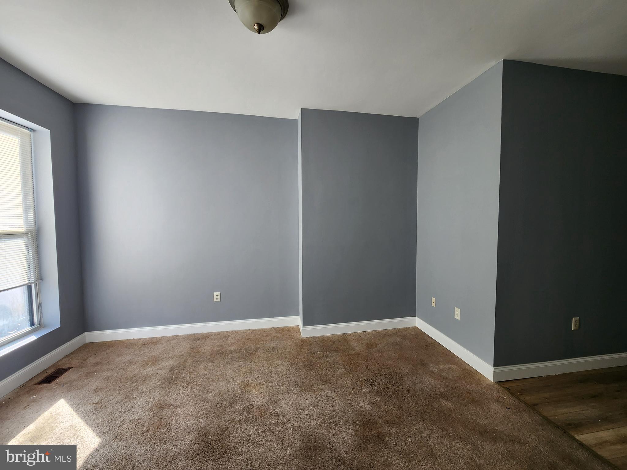 32 South Fulton Avenue Baltimore, MD 21223 - Photo 4 of 29 a view of an empty room with a window