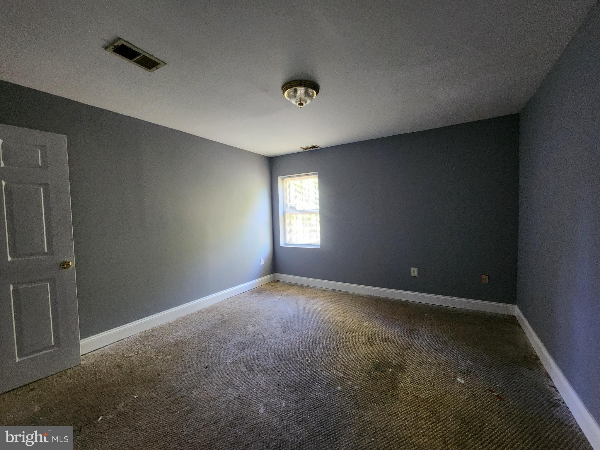 32 South Fulton Avenue Baltimore, MD 21223 - Photo 10 of 29 an empty room with windows and closet