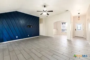 a view of an empty room with a window