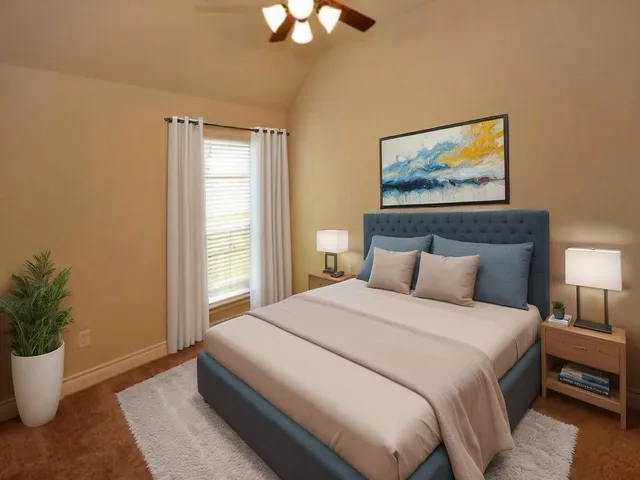 a bedroom with bed and painting on the wall