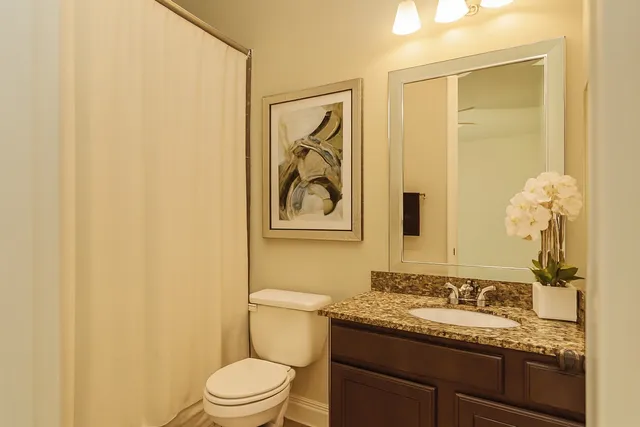 a bedroom with a large bed and a large window