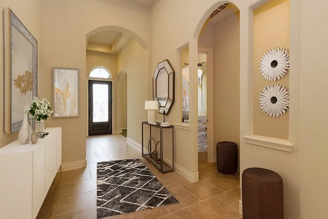 a spacious bathroom with a mirror a sink and a shower