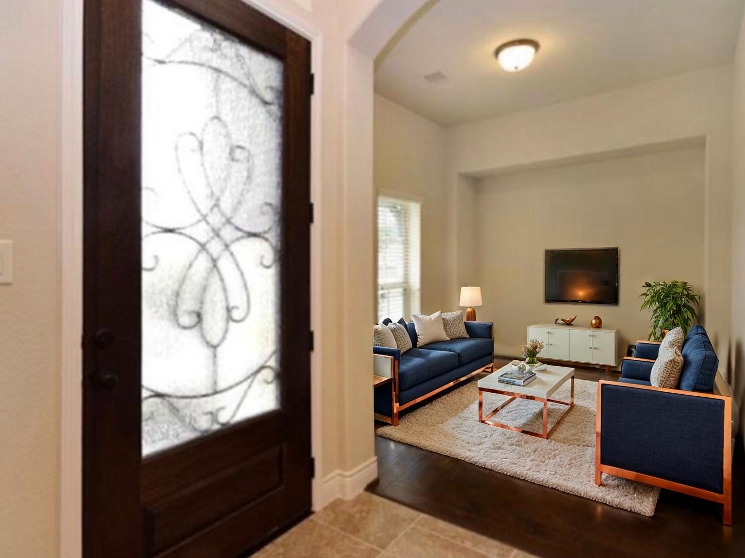 1715 Ketelby Reach Spring, TX 77386 - Photo 25 of 26 a living room with furniture and a flat screen tv
