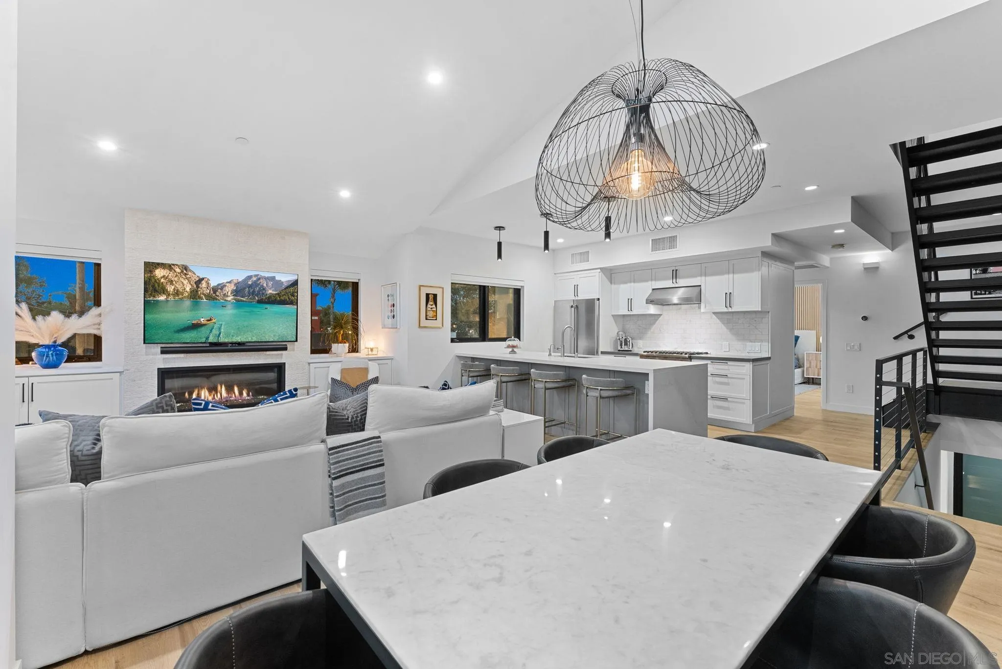 768 North Coast Highway 101 Encinitas, CA 92024 - Photo 12 of 68 a living room with fireplace furniture and a flat screen tv