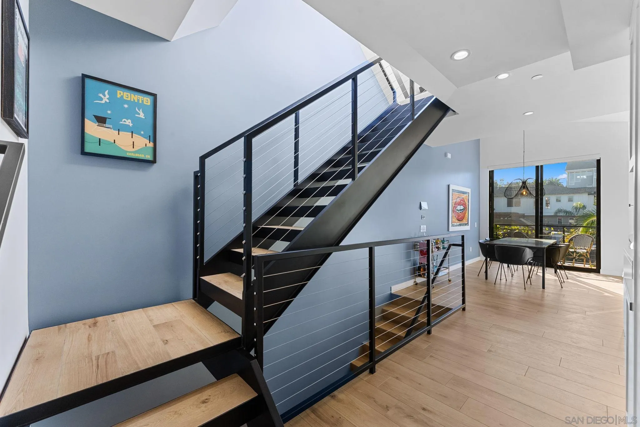 768 North Coast Highway 101 Encinitas, CA 92024 - Photo 20 of 68 a view of entryway dining room and hall with wooden floor