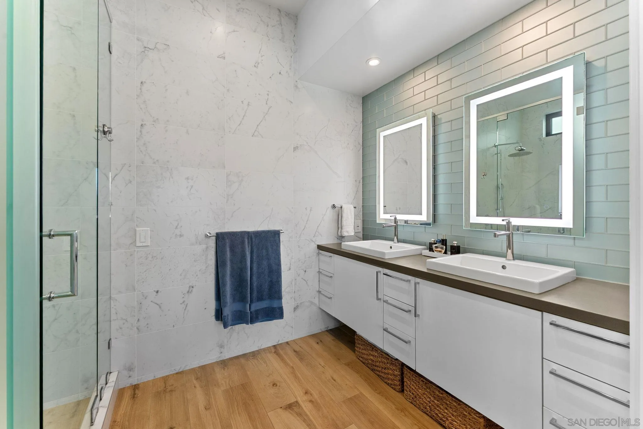 768 North Coast Highway 101 Encinitas, CA 92024 - Photo 36 of 68 a bathroom with a sink and a mirror