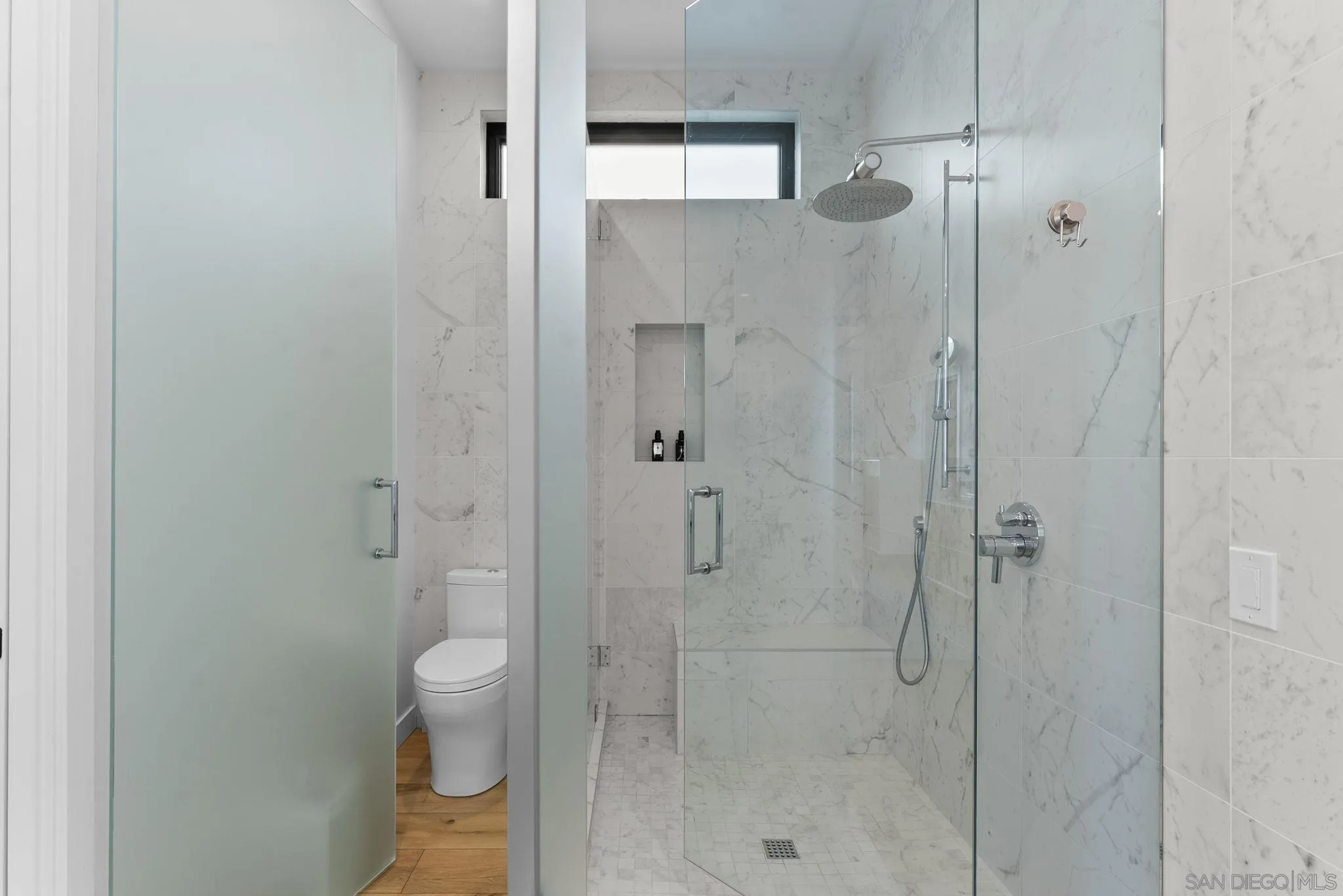 768 North Coast Highway 101 Encinitas, CA 92024 - Photo 37 of 68 a bathroom with a shower and toilet