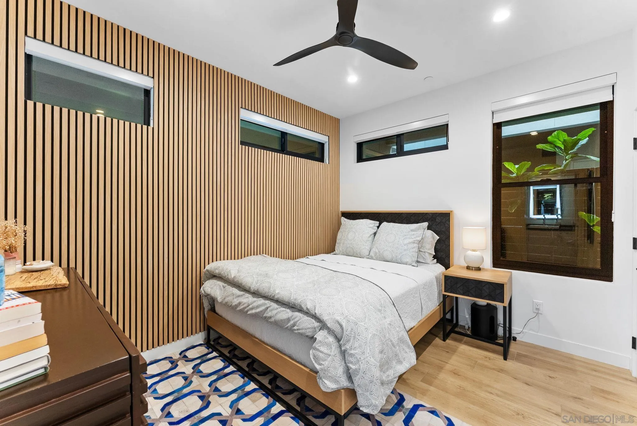 768 North Coast Highway 101 Encinitas, CA 92024 - Photo 38 of 68 a bedroom with a bed and a flat screen tv