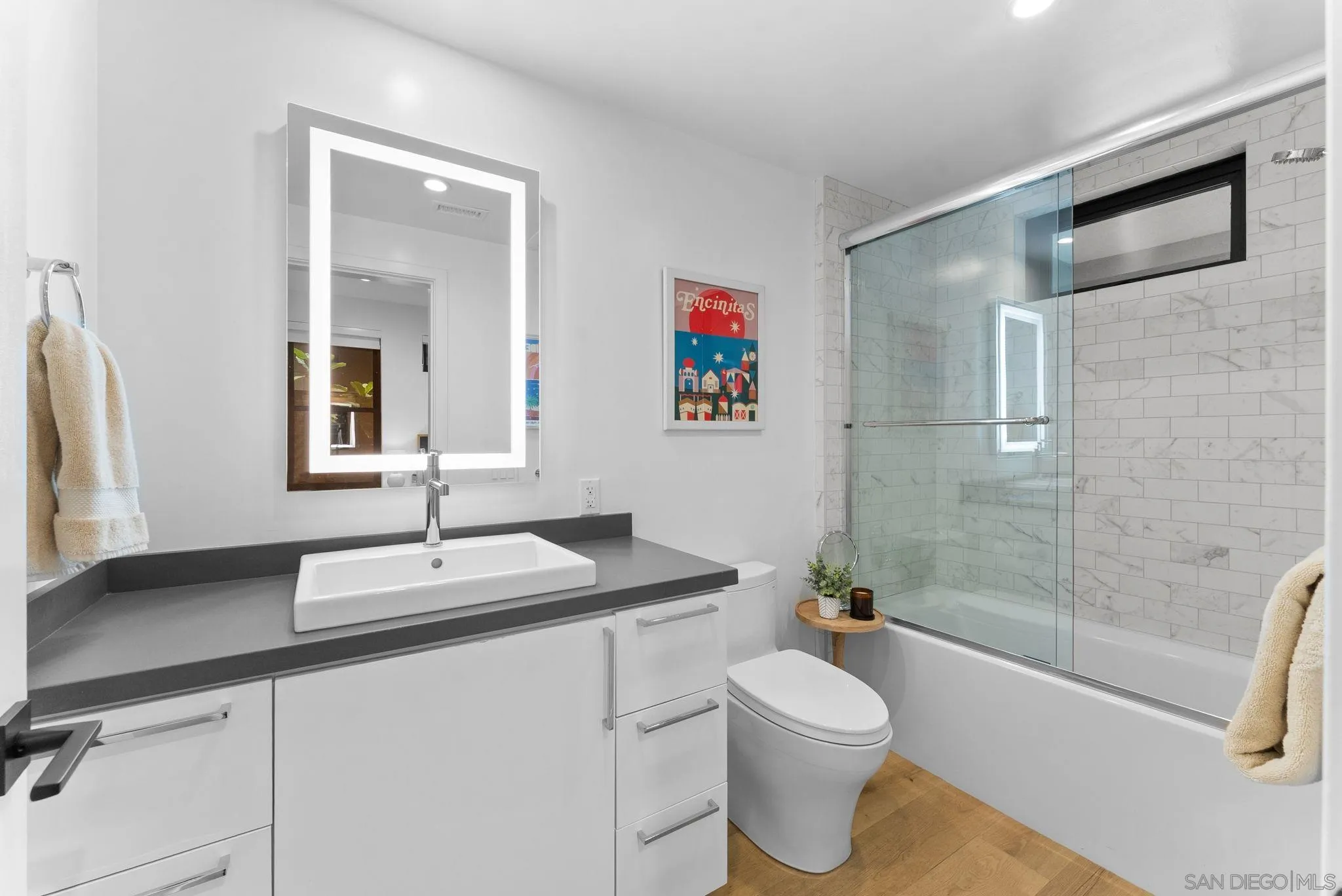 768 North Coast Highway 101 Encinitas, CA 92024 - Photo 40 of 68 a bathroom with a sink a toilet and shower