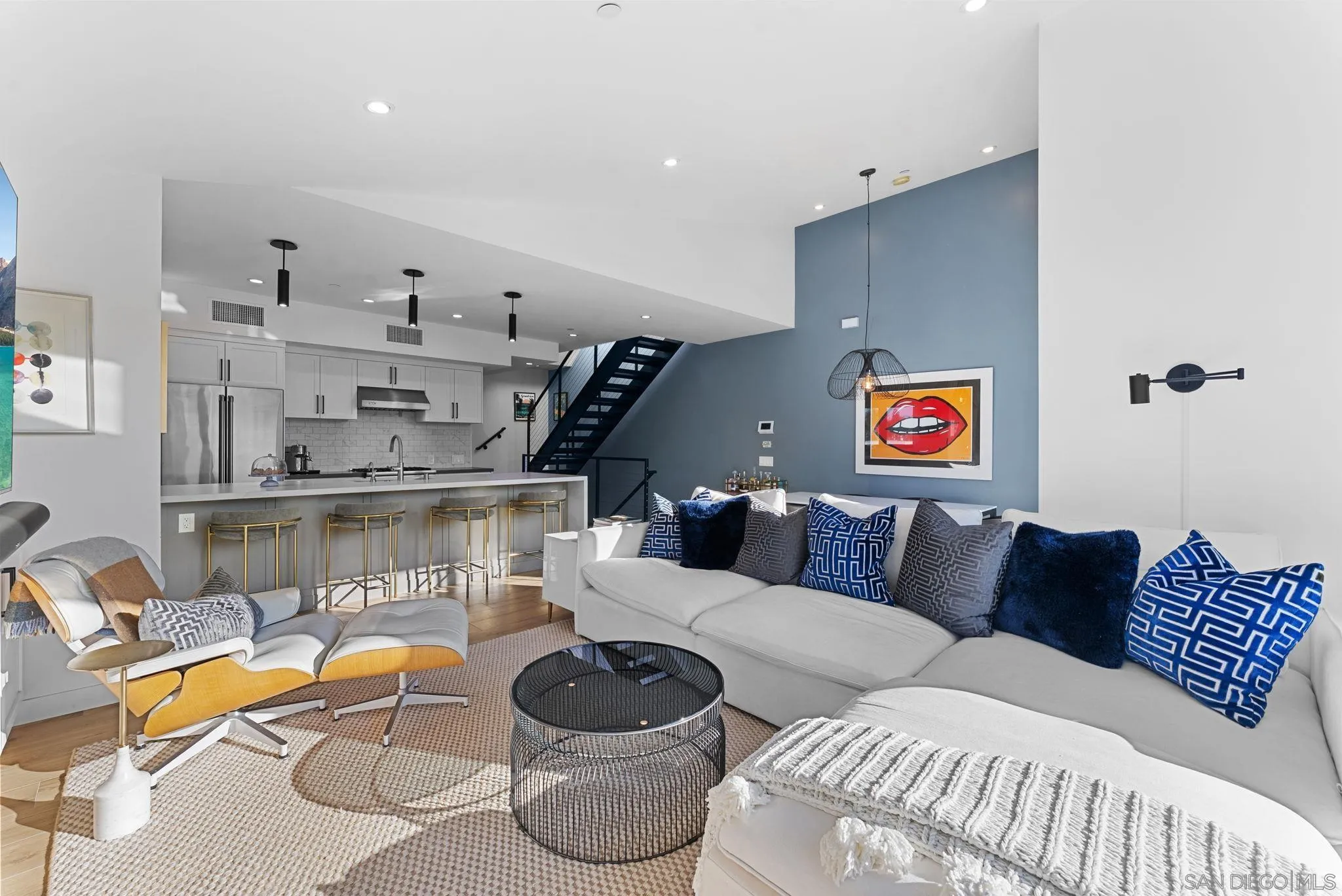 768 North Coast Highway 101 Encinitas, CA 92024 - Photo 10 of 68 a living room with furniture a rug and a painting