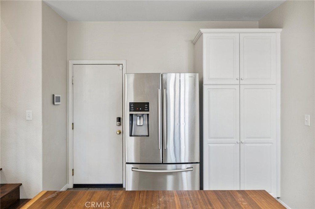 46221 Jane Place Temecula, CA 92592 - Photo 12 of 41 a metallic refrigerator freezer sitting in a kitchen