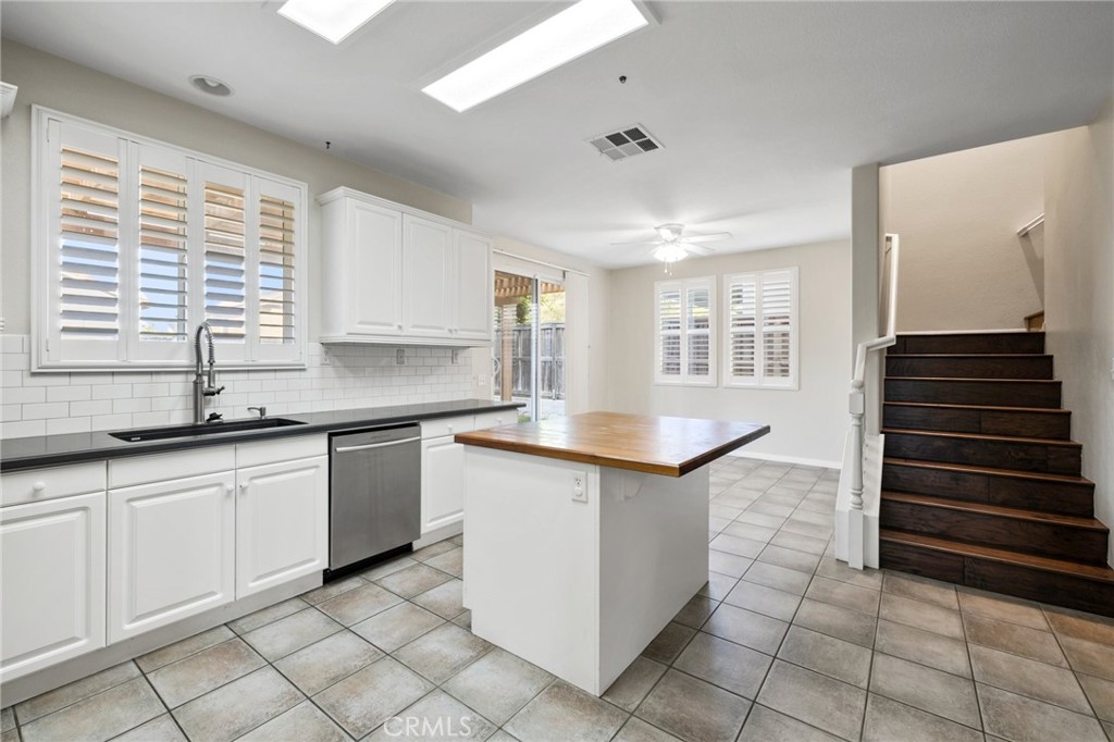 46221 Jane Place Temecula, CA 92592 - Photo 14 of 41 a kitchen with granite countertop a sink and a stove