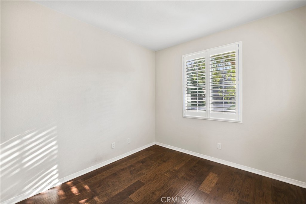 46221 Jane Place Temecula, CA 92592 - Photo 18 of 41 an empty room with wooden floor and windows