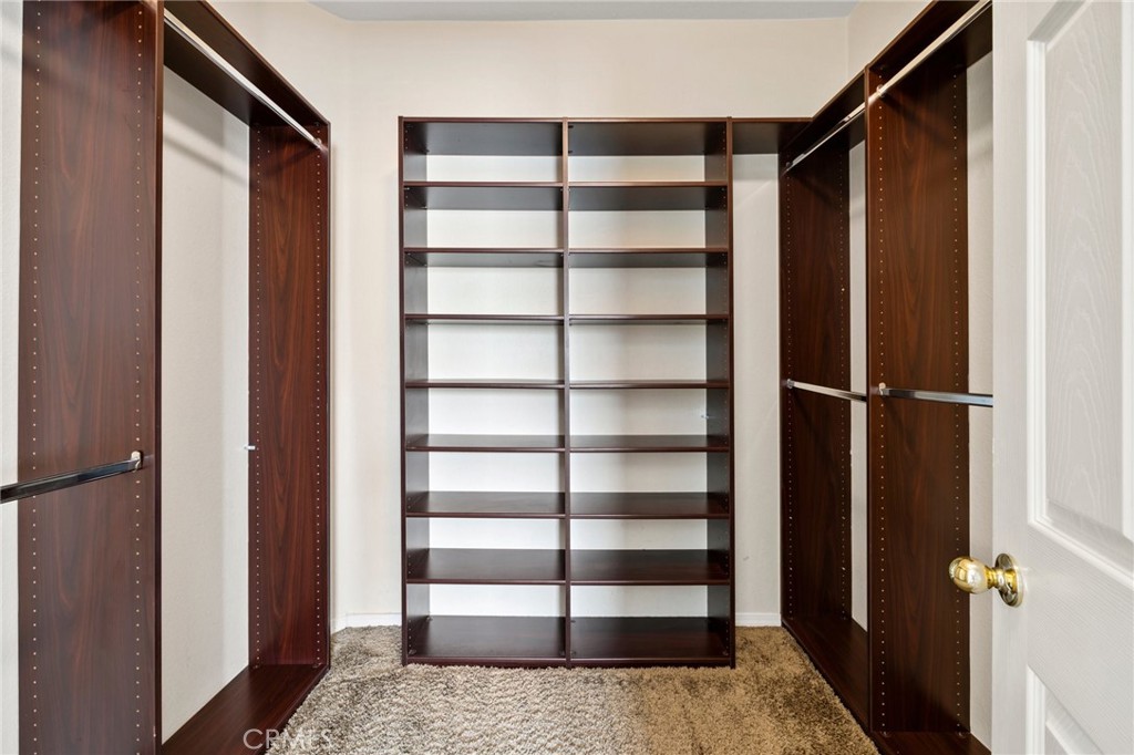 46221 Jane Place Temecula, CA 92592 - Photo 30 of 41 a view of closet area with empty racks
