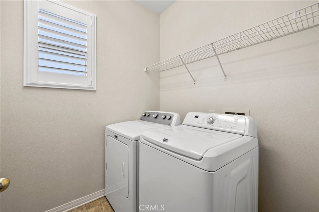 46221 Jane Place Temecula, CA 92592 - Photo 31 of 41 a utility room with dryer and washer