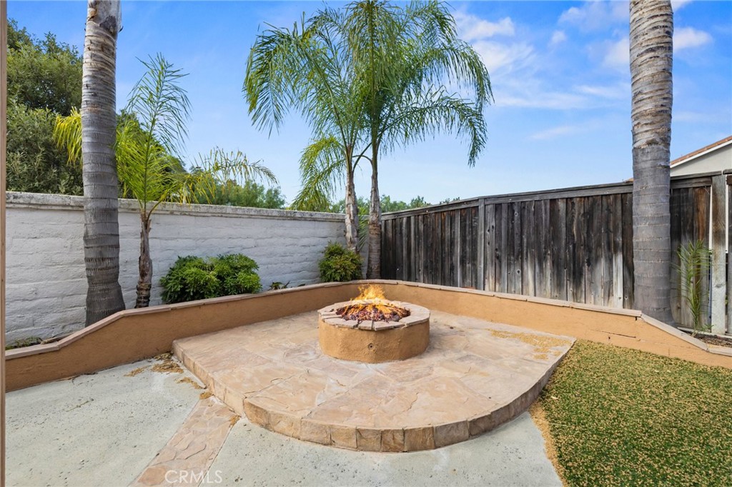 46221 Jane Place Temecula, CA 92592 - Photo 36 of 41 a backyard of a house with table and chairs plants