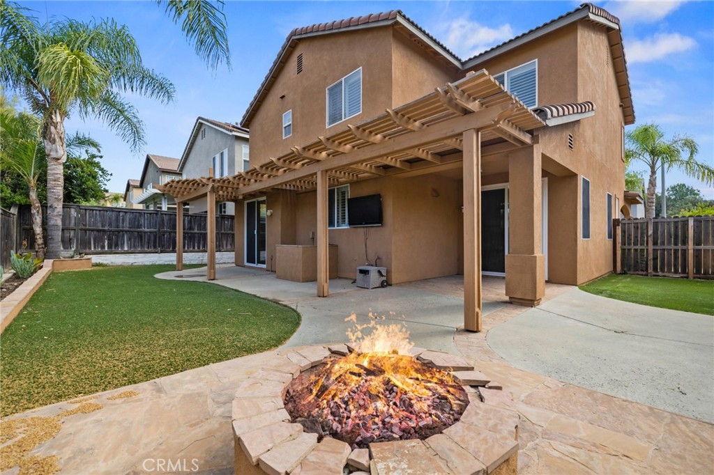 46221 Jane Place Temecula, CA 92592 - Photo 37 of 41 a view of a white house with a small yard plants and palm trees