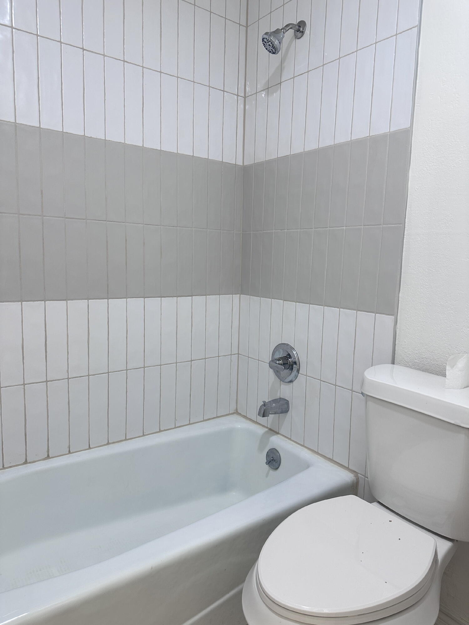 2217 33rd Street, Unit B Lubbock, TX 79411 - Photo 12 of 14 a bathroom with a toilet and bathtub