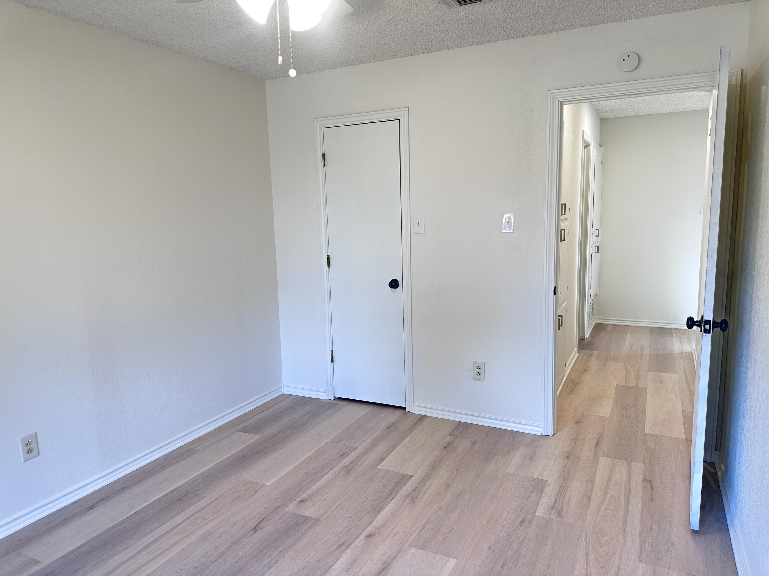 2217 33rd Street, Unit B Lubbock, TX 79411 - Photo 14 of 14 wooden floor in an empty room