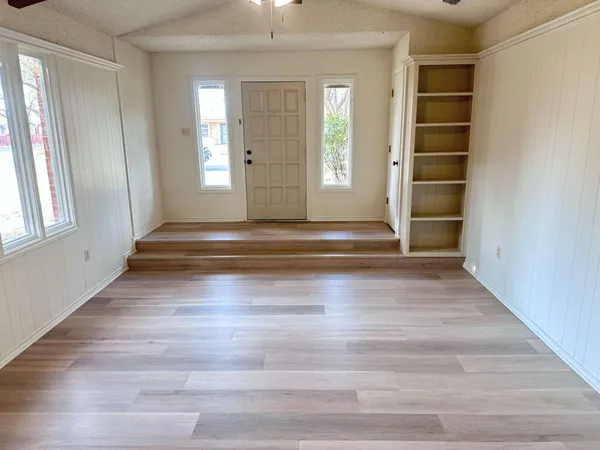 a view of room with window and hardwood floor