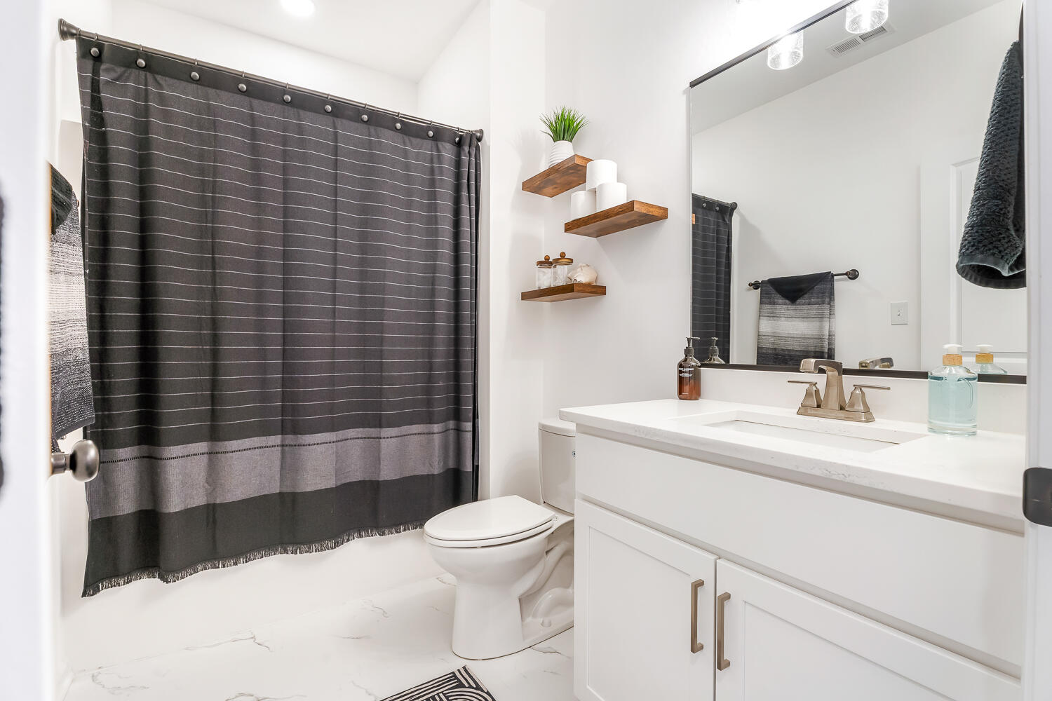 709 Verdano Terrace Crown Point, IN 46307 - Photo 11 of 39 a bathroom with a sink a toilet and shower