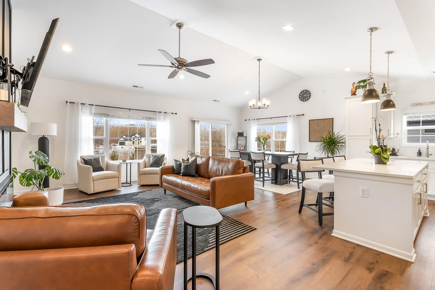 709 Verdano Terrace Crown Point, IN 46307 - Photo 12 of 39 a living room with furniture kitchen view and a wooden floor