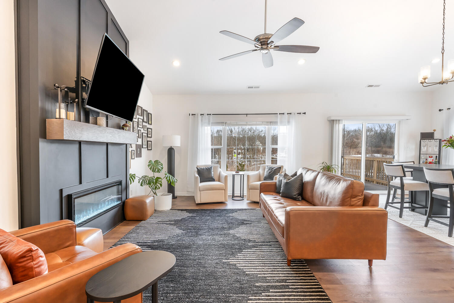 709 Verdano Terrace Crown Point, IN 46307 - Photo 13 of 39 a living room with fireplace furniture and a flat screen tv