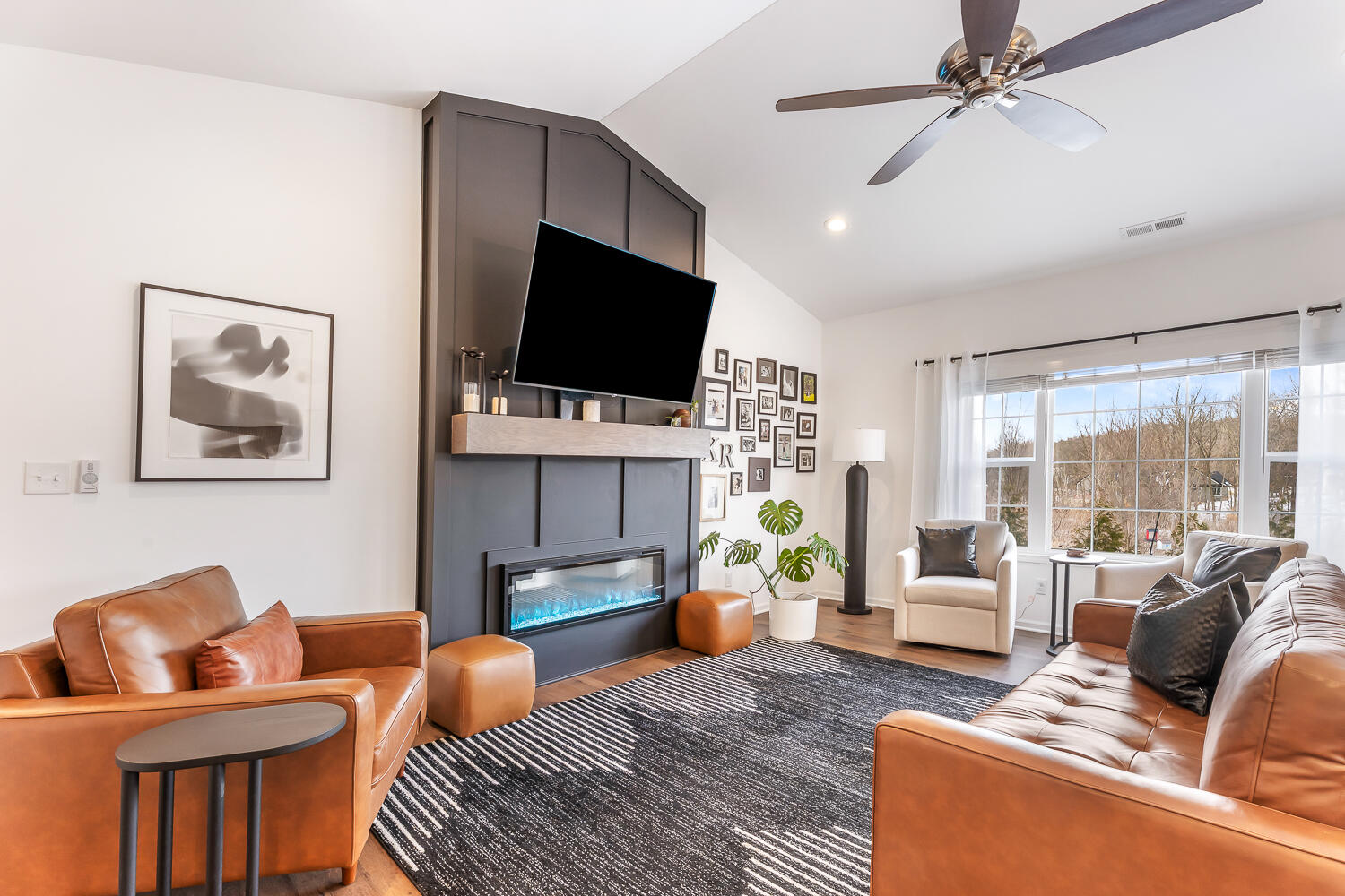 709 Verdano Terrace Crown Point, IN 46307 - Photo 14 of 39 a living room with furniture and a flat screen tv