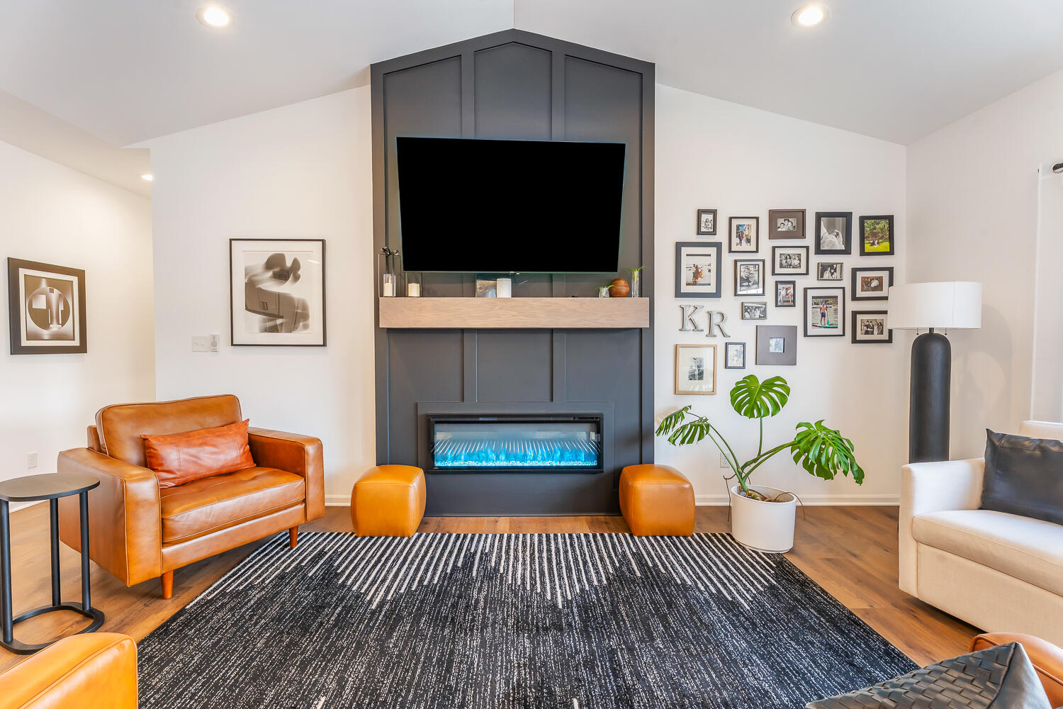 709 Verdano Terrace Crown Point, IN 46307 - Photo 15 of 39 a living room with furniture a fireplace and a flat screen tv