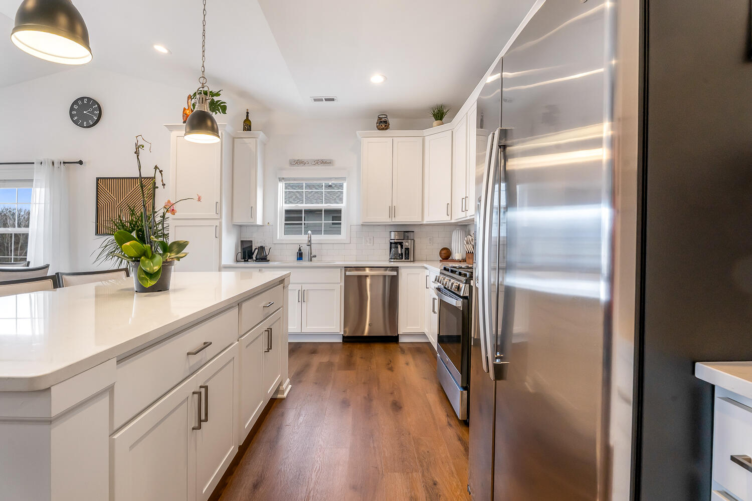 709 Verdano Terrace Crown Point, IN 46307 - Photo 19 of 39 a kitchen with white cabinets and stainless steel appliances