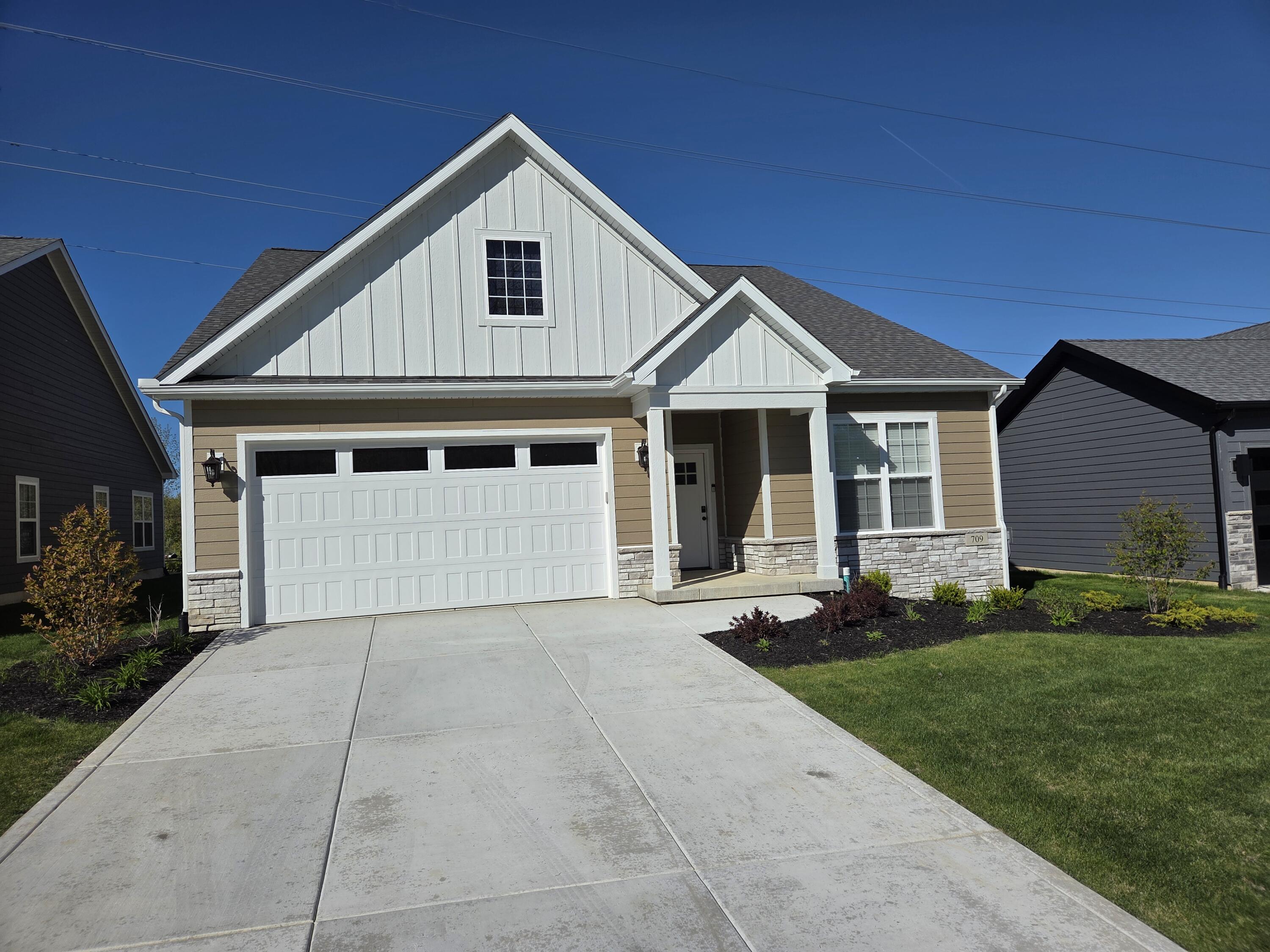 709 Verdano Terrace Crown Point, IN 46307 - Photo 2 of 39 a front view of a house with a garden and yard