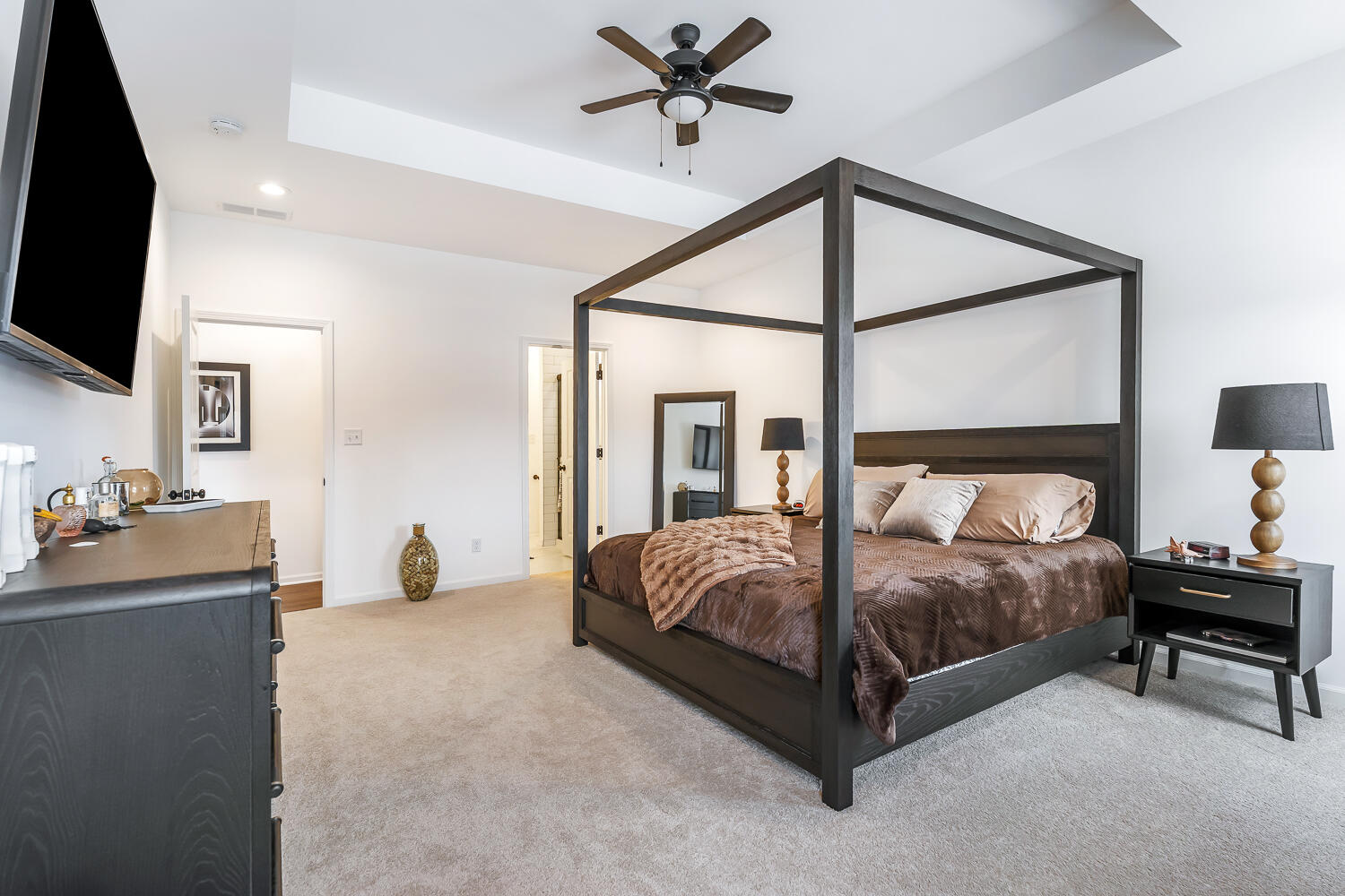709 Verdano Terrace Crown Point, IN 46307 - Photo 25 of 39 a bedroom with a bed and a flat tv screen on dresser