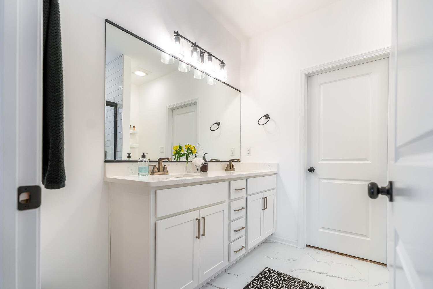 709 Verdano Terrace Crown Point, IN 46307 - Photo 27 of 39 a bathroom with a double vanity sink a mirror and shower