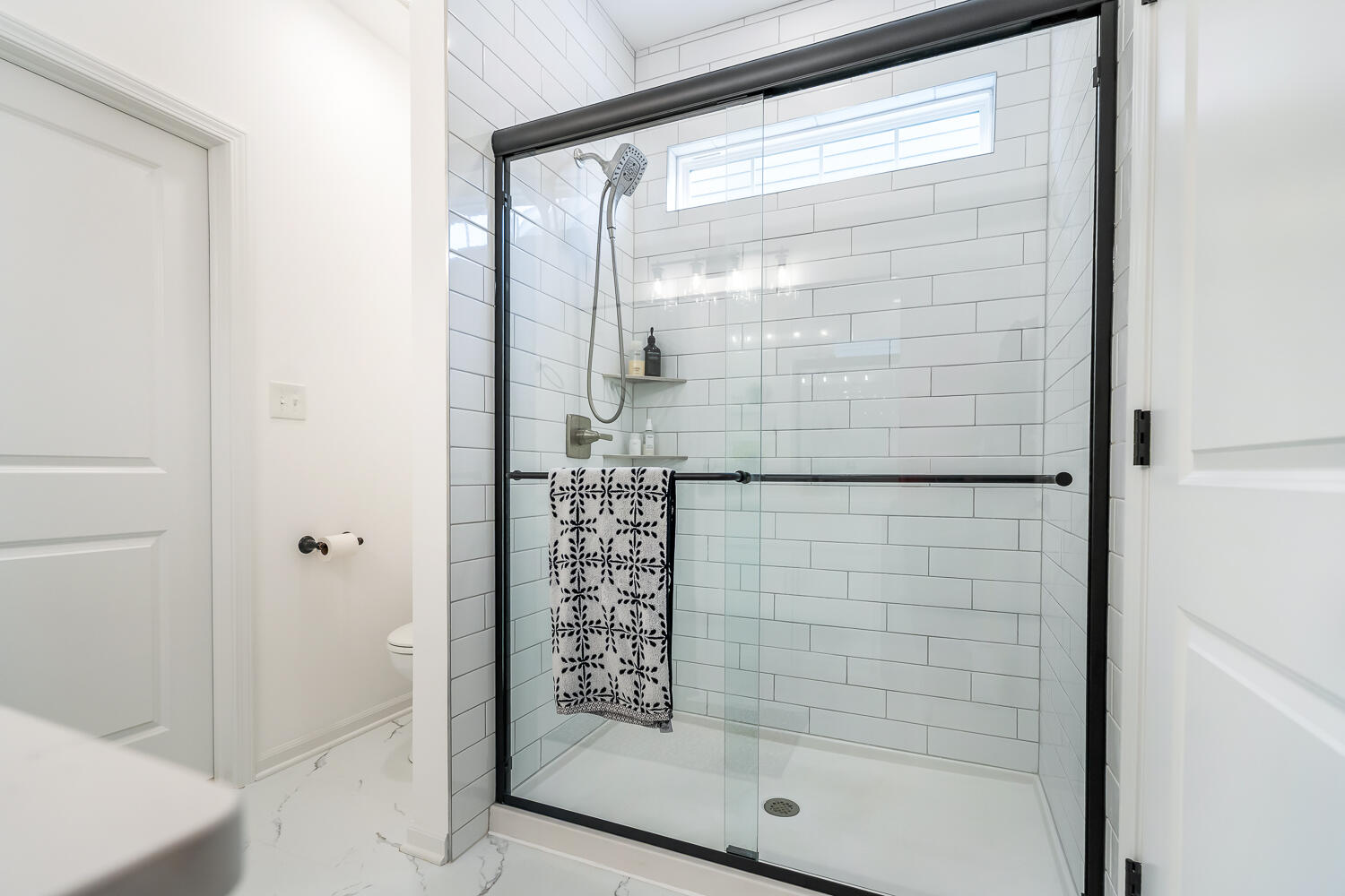 709 Verdano Terrace Crown Point, IN 46307 - Photo 28 of 39 a bathroom with a glass shower door