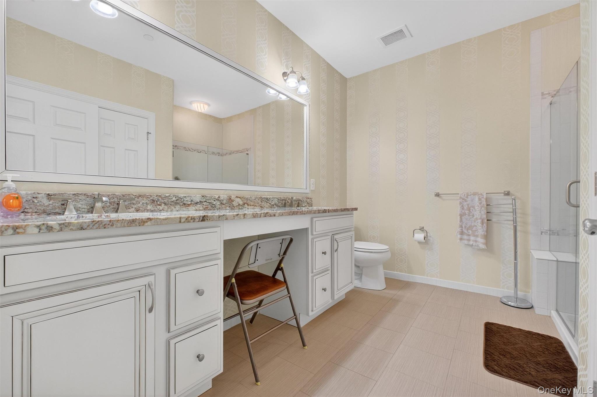 734 Regency Drive Fishkill, NY 12524 - Photo 19 of 45 a spacious bathroom with a granite countertop sink a toilet and a shower