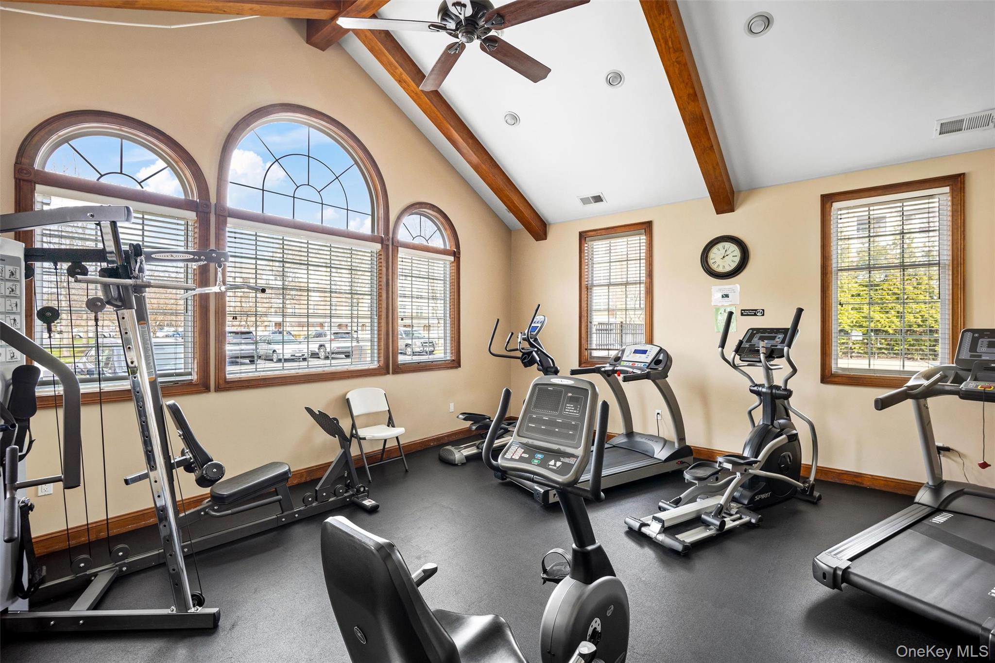 734 Regency Drive Fishkill, NY 12524 - Photo 33 of 45 a room with gym equipment and a large window
