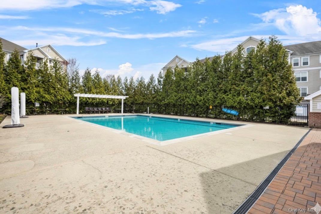 734 Regency Drive Fishkill, NY 12524 - Photo 35 of 45 a view of swimming pool with a yard and sitting area