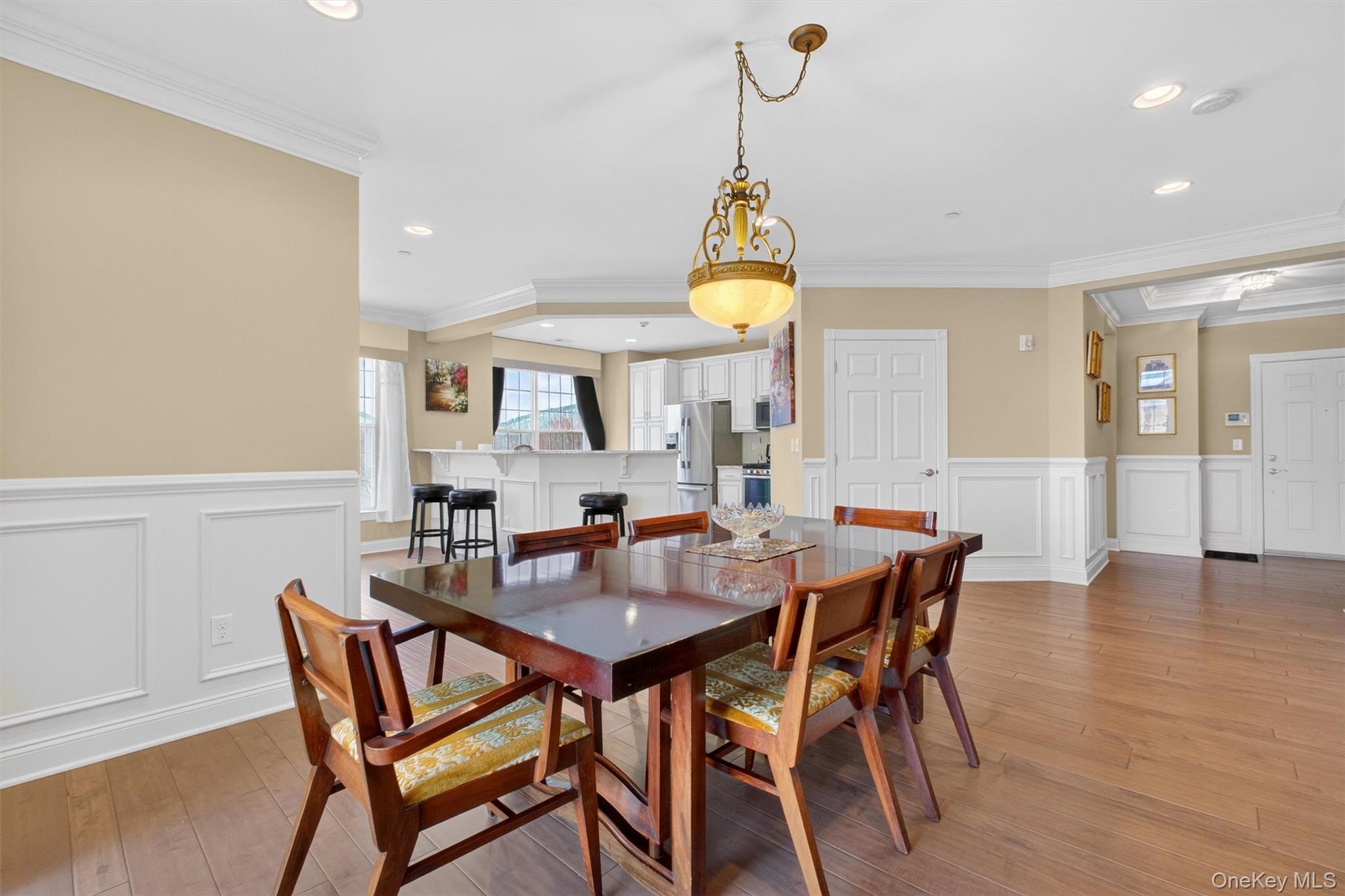 734 Regency Drive Fishkill, NY 12524 - Photo 9 of 45 a view of a dining room with furniture and wooden floor