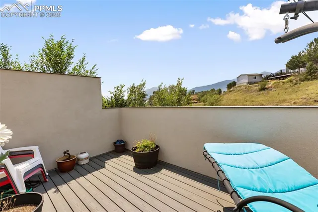 a view of a chairs and table in patio