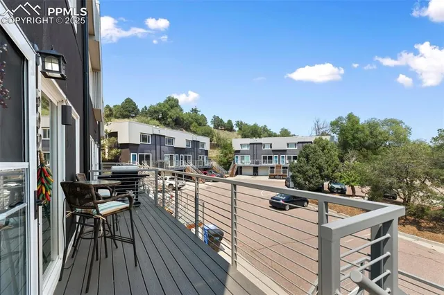 a view of a balcony with chairs