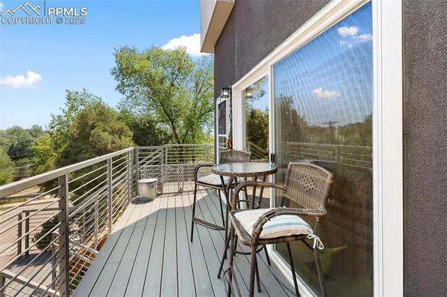 a view of a chairs on the roof deck