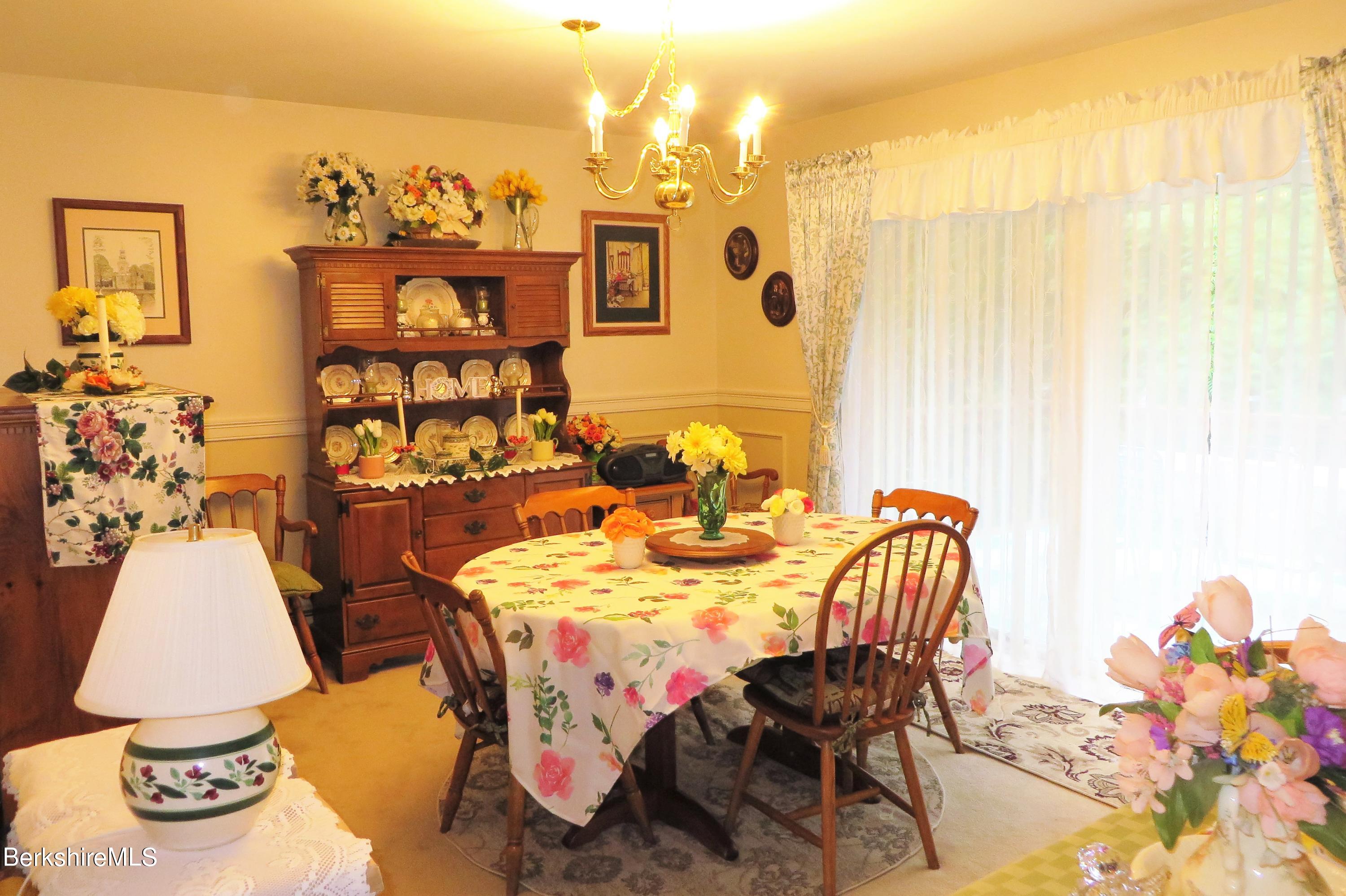 751 Mohawk Trail, Unit 1D North Adams, MA 01247 - Photo 16 of 32 a view of a dining room with furniture and chandelier