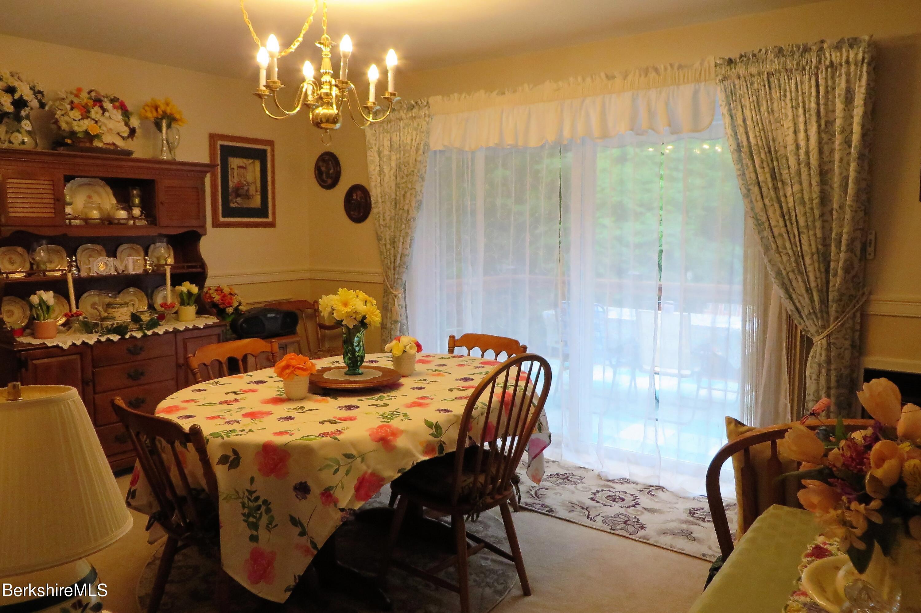 751 Mohawk Trail, Unit 1D North Adams, MA 01247 - Photo 17 of 32 a view of a dining room with furniture and chandelier